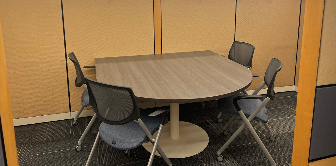 cubicle with table and four chairs