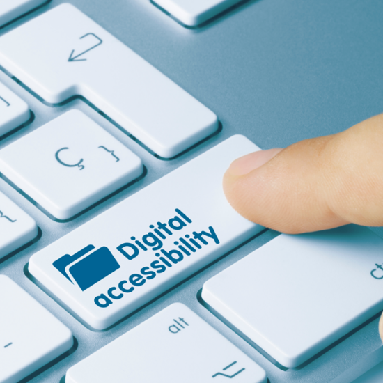 finger touching a computer keyboard with one key labelled